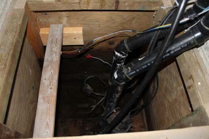 Open sump pit with sensor wiring